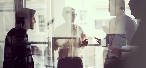 Businesspeople discussing technical partnerships in cybersecurity