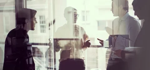 Businesspeople discussing technical partnerships in cybersecurity
