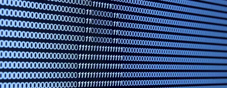 Zoomed in photo on some binary code across a screen