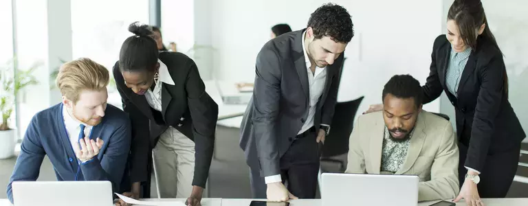 Coworkers discussing business email compromise (BEC)