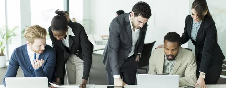 Coworkers discussing spoofed branded customer service Twitter accounts