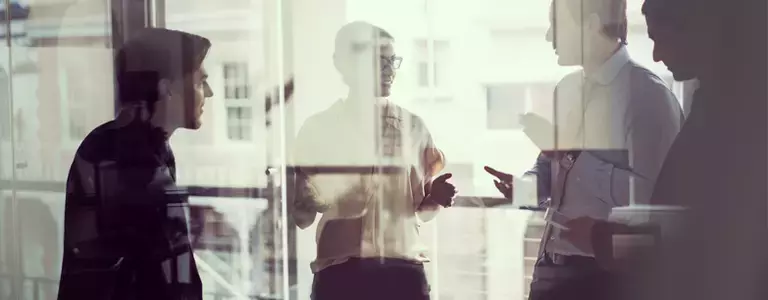 Businesspeople discussing technical partnerships in cybersecurity