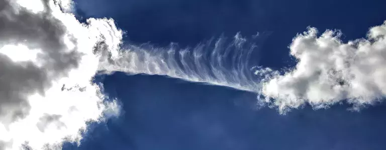 High contrast photo of clouds in a dark blue sky