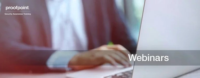 Businessman working on his laptop with the word 'Webinars' overlaid