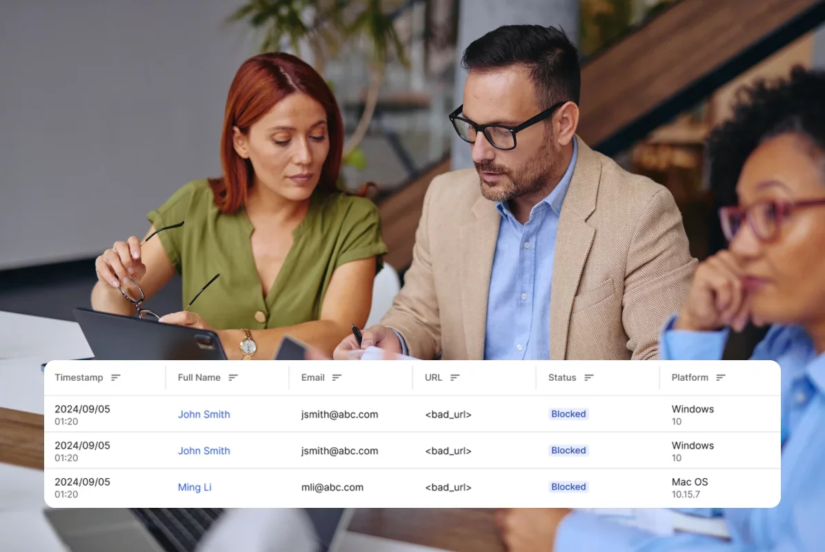 Three people reviewing report